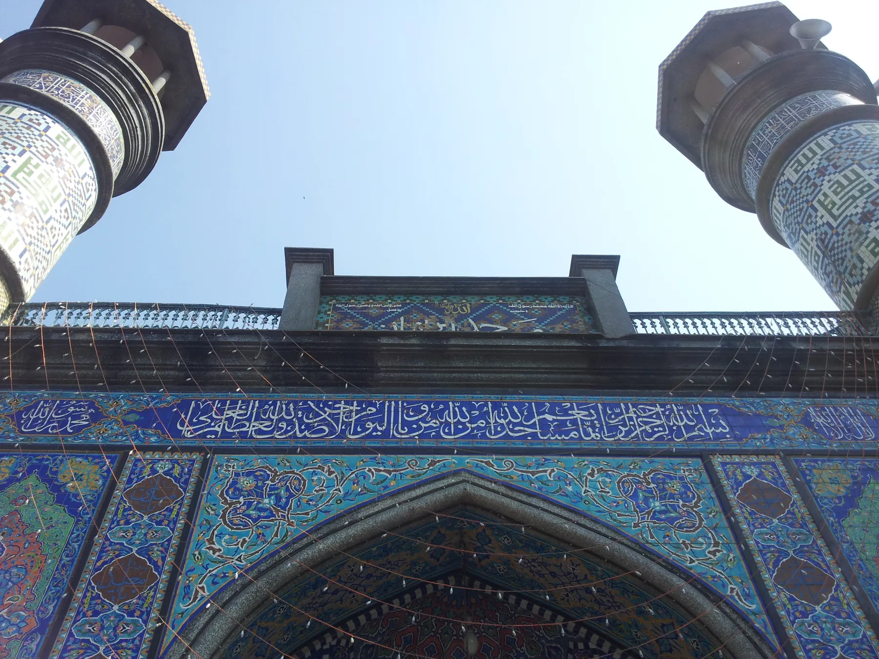 Blue tiled minarets and calligraphic portal of the Mughal Masjid (Masjid-e-Iranian), Dongri, Mumbai